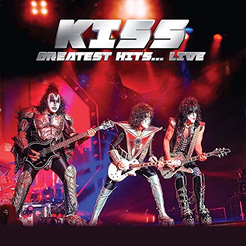 Kiss band members performing live on stage, album cover.