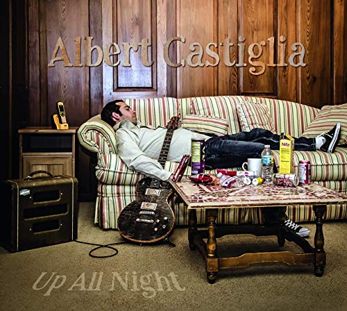 Albert Castiglia album cover: man lounging with guitar, messy room.