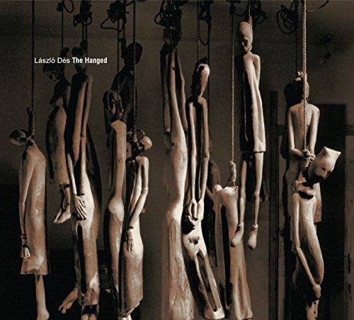 Hanging sculpted figures in a dimly lit, monochromatic space.