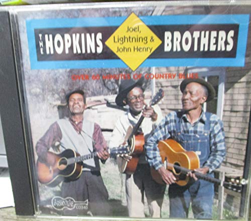 CD cover featuring three Black men playing acoustic guitars.