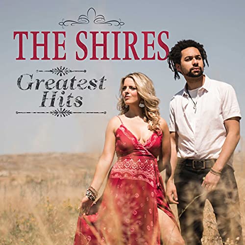 The Shires Greatest Hits album cover featuring a man and woman in a field.
