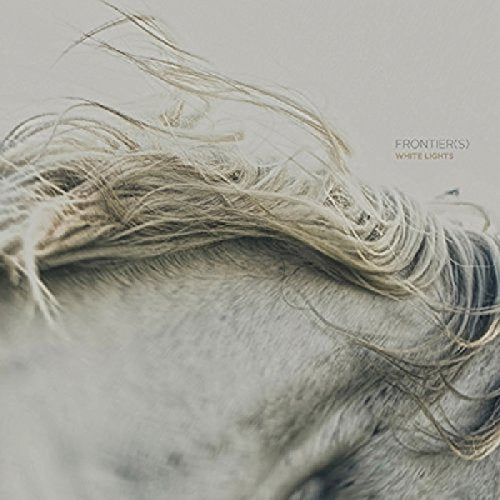 Close-up of a white horse’s mane with text “FRONTIER(S) WHITE LIGHTS”.