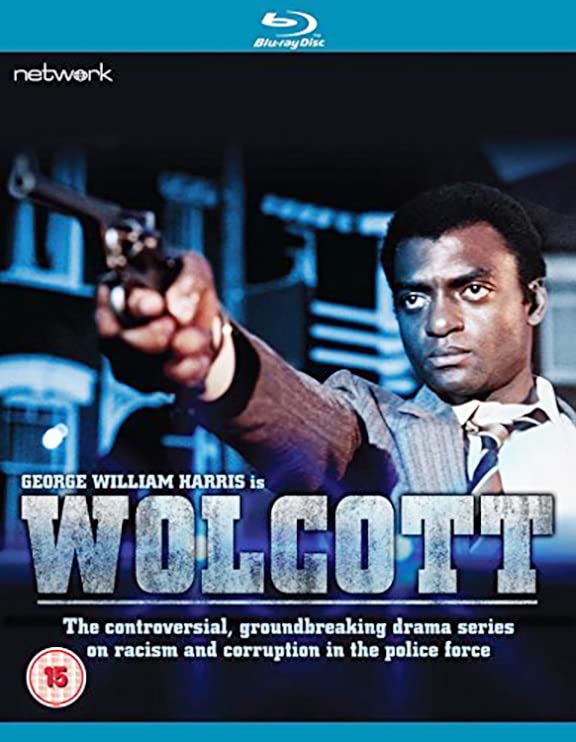 Blu-ray cover for "Wolcott" featuring a man holding a gun, dramatic lighting.