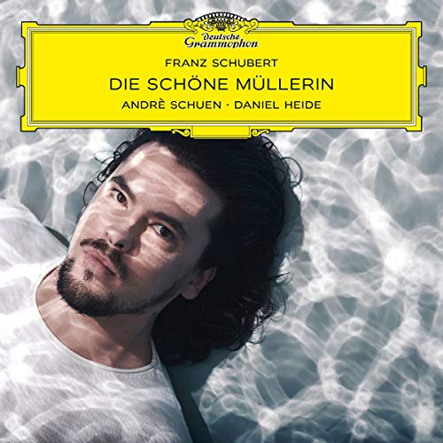 CD cover featuring a portrait of a man with dark, curly hair.