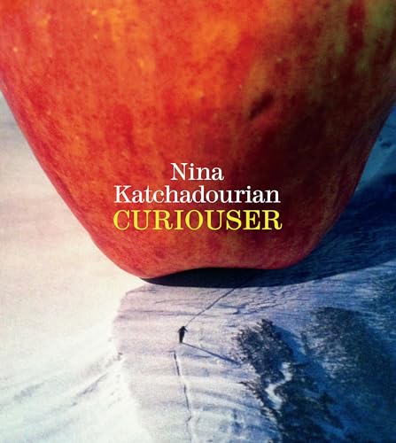 Large red apple looms over a snowy landscape with a tiny figure.