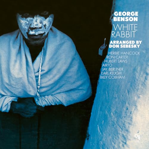 Album cover for George Benson’s “White Rabbit” featuring a portrait of a man.