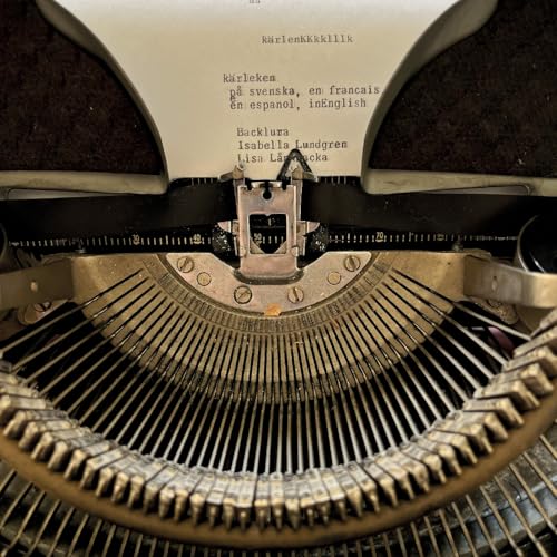 Typewriter with typed text reading “Karleken” in multiple languages.