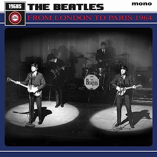 The Beatles performing on stage in black and white, vinyl record cover.