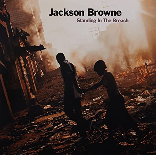 Album cover: couple silhouetted amidst rubble and smoke, titled "Standing in the Breach".