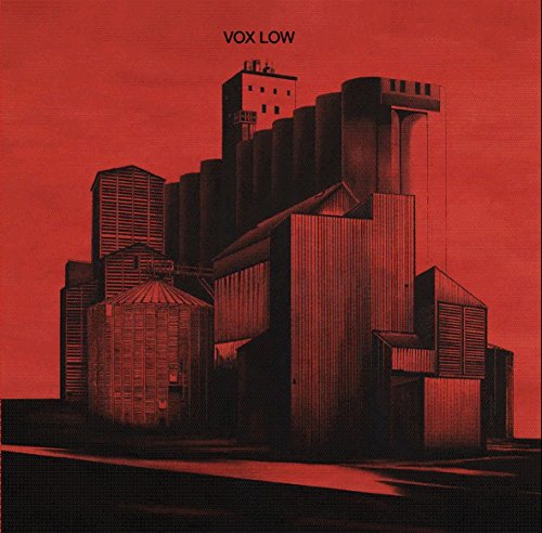 Red album cover depicting a detailed illustration of industrial grain elevators.