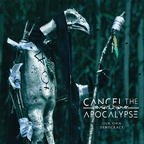 CD cover featuring a bird skeleton with symbols, draped in black fabric, holding a staff.