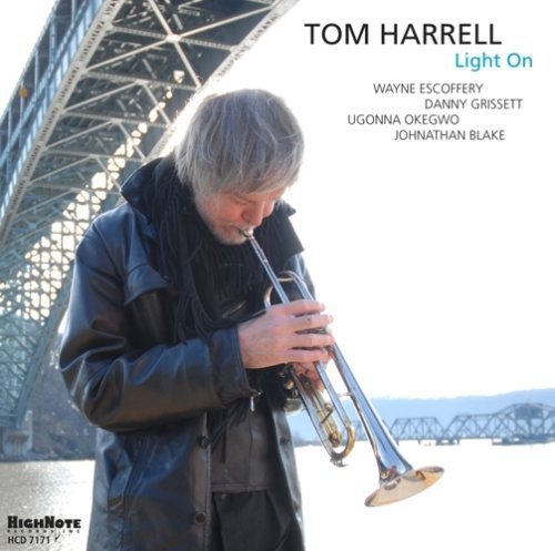 Tom Harrell album cover featuring a man playing a trumpet, bridge background.