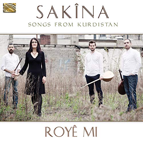 CD cover featuring four musicians in front of a weathered building.