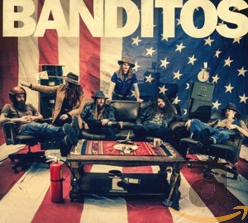 Banditos album cover featuring a band posing in front of an American flag.