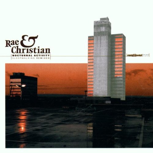 CD cover with tall buildings at dusk, orange and gray tones.