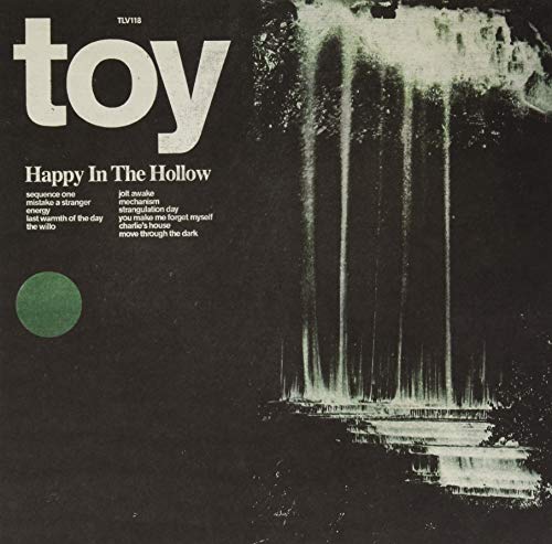 Vinyl record cover for Toy’s “Happy in the Hollow” with a waterfall scene.