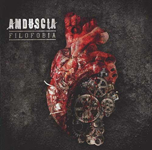 CD cover: mechanical gears embedded within a textured, red human heart.