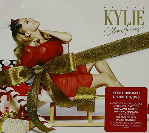 Kylie Minogue Christmas album cover featuring a woman in red, with gold ribbon.