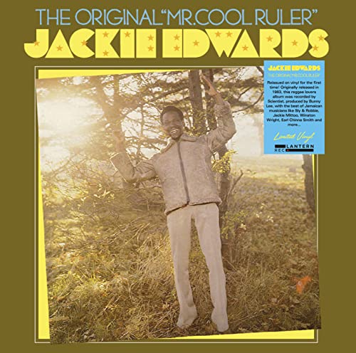 Jackie Edwards album cover, a man in a suit poses in a field.