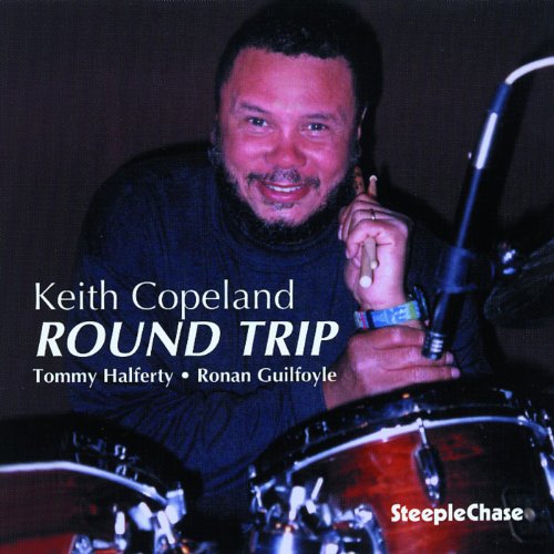 CD cover featuring jazz drummer Keith Copeland smiling behind his drum kit.