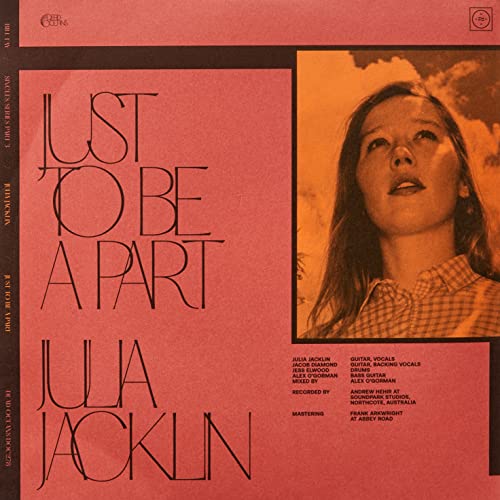 Vinyl album cover featuring Julia Jacklin’s portrait with red and gold tones.