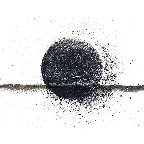 Dark sphere with grainy texture above a thin brown line, white background.