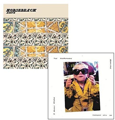 Two vinyl record covers: patterned tile and a child in sunglasses.