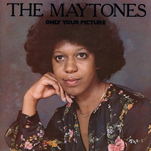 CD cover: portrait of a woman with an afro, floral shirt.