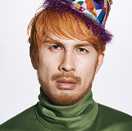 Ken Hirai portrait, red hair, colorful hat, green turtleneck sweater.