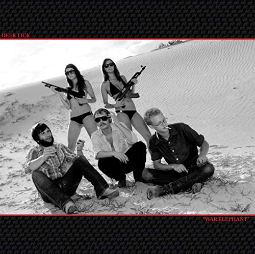 Black and white album cover of band Deer Tick in a desert landscape.