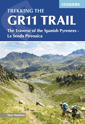 Hiking guidebook with map and trail route information on a Pyrenees mountain range cover.
