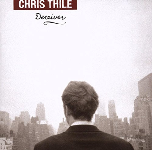 Man viewed from behind looks out over a cityscape, album cover.