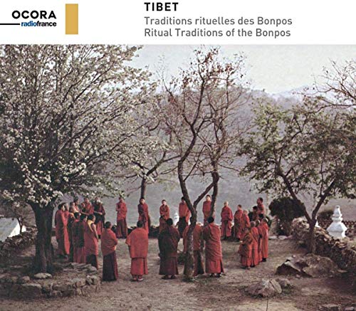 CD cover: monks in red robes gathered beneath blossoming trees.