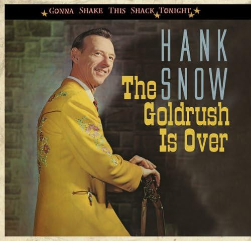 Hank Snow in yellow suit, album cover with brick background.