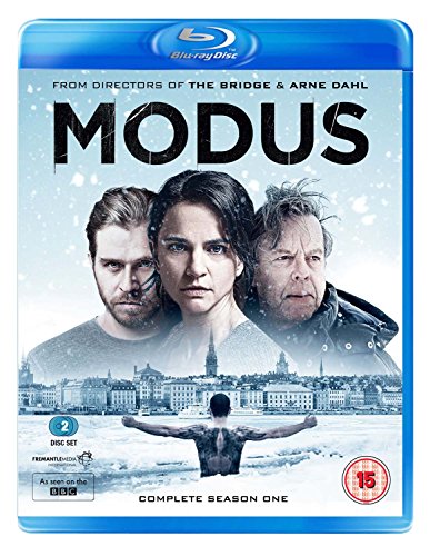 “Modus” Blu-ray cover featuring three faces and a snowy cityscape.