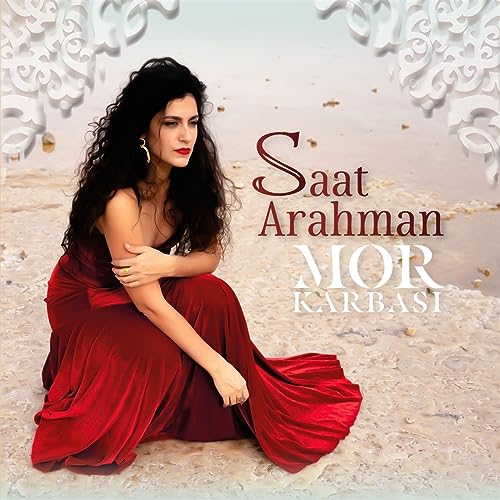 CD cover featuring a woman in red with album title "Saat Arahman".