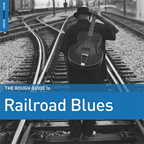 Man with guitar walking on railroad tracks, album cover art.