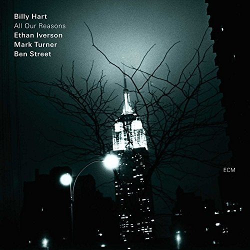 CD cover: dark cityscape with illuminated Empire State Building and bare branches.