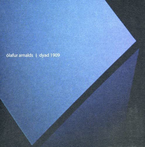 Blue album cover for Ólafur Arnalds’ “Dyad 1909” with geometric shapes.
