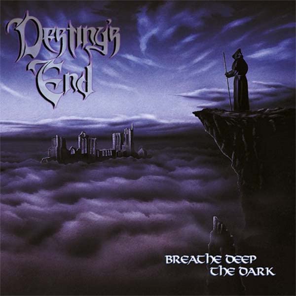 CD cover: cloaked figure on cliff overlooking a dark, cloudy city.