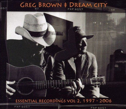Black and white photo of Greg Brown with a guitar, album details below.