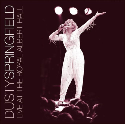 Dusty Springfield singing into a microphone on stage at Royal Albert Hall.