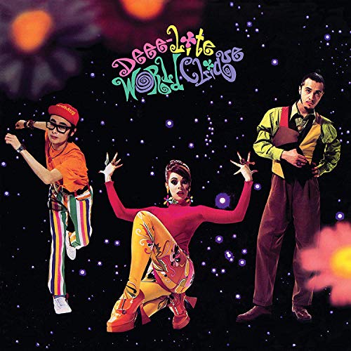 Album cover for Dee-lite’s “World Clique” featuring three dancers against a dark background.