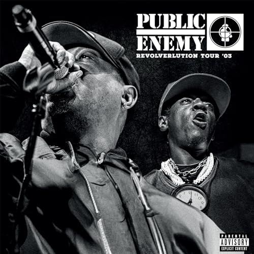 Black and white image of Chuck D performing with Flavor Flav.