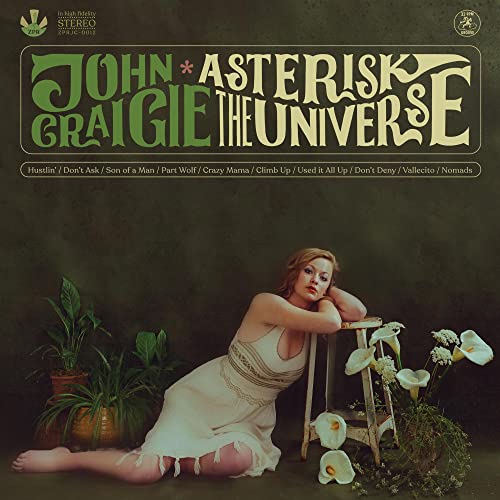 CD cover: woman in white dress, plants, and album title “Asterisk The Universe”.