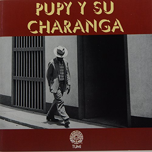 CD cover: man walking past a doorway, text “Pupy Y Su Charanga”.