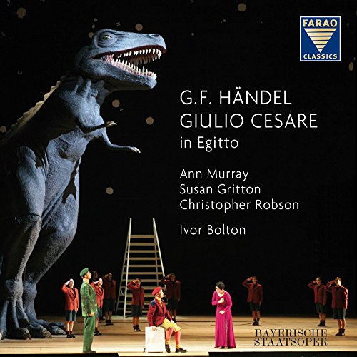 CD cover: blue dinosaur with performers in red uniforms onstage.