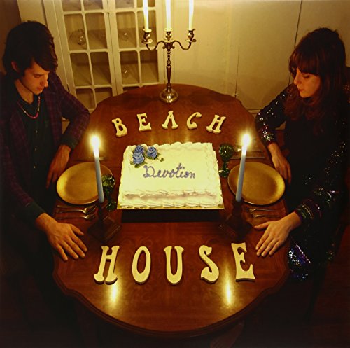 Beach House album cover: two people at a table with a cake.