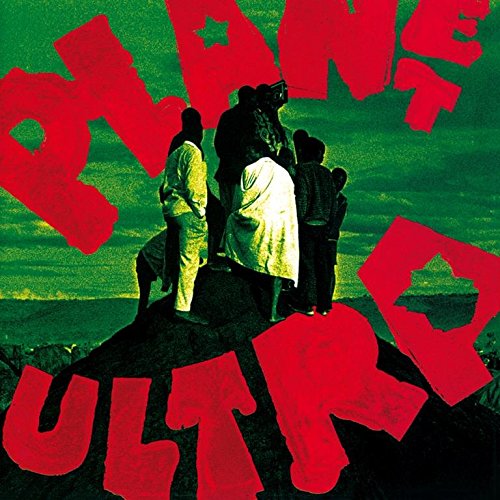 Album cover: group on hill with large red text overlay.