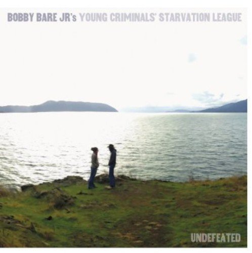 CD cover: Two figures stand on a grassy hill overlooking water.